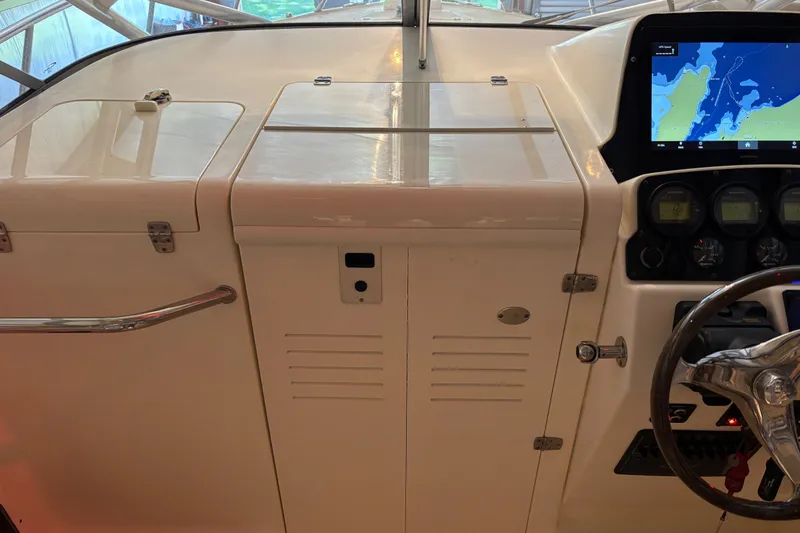 Slide: The Image of 2007 Scout 262 Abaco boat dashboard with navigation screen and steering wheel. - 14