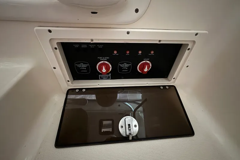 Slide: The Image of Control panel of a 2007 Scout 262 Abaco boat with switches and dials. - 23