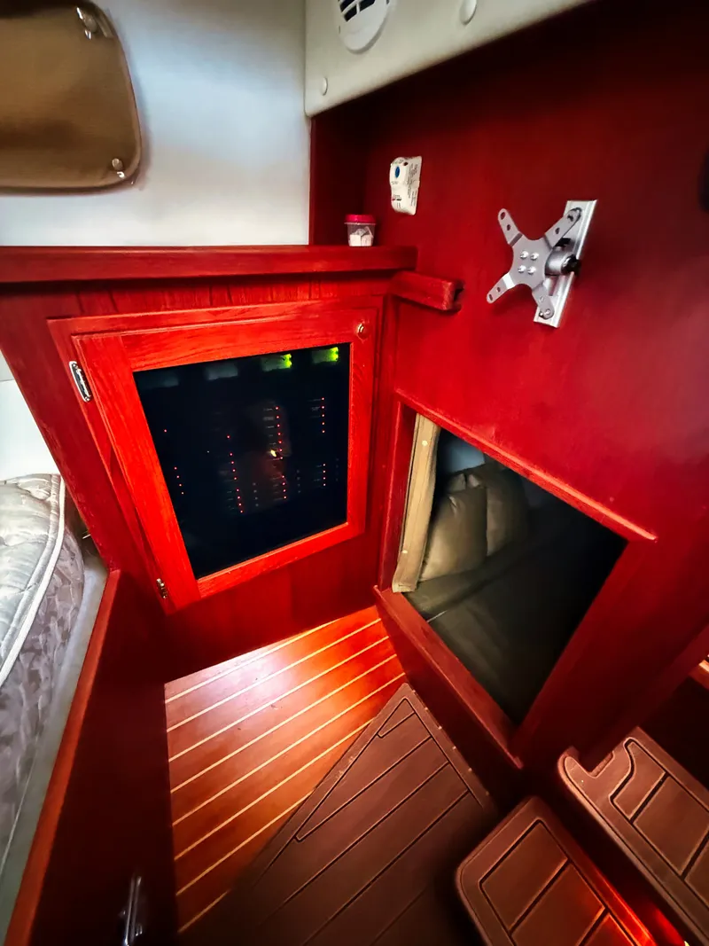 Slide: The Image of Interior of the 2005 SeaSport Voyager 3000 with wood flooring and electronic control panel. - 12