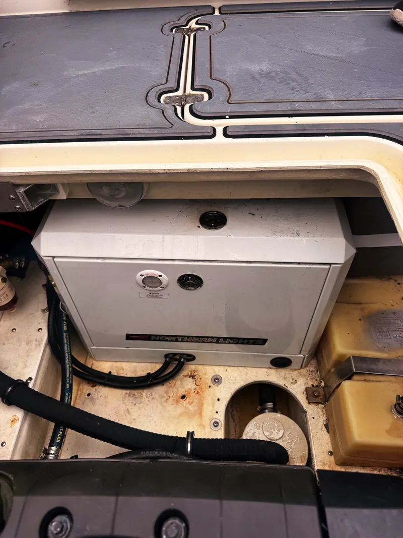 Slide: The Image of An open compartment in the boat reveals a battery and wiring. - 17
