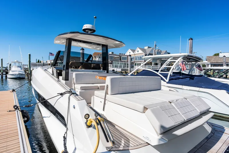 Slide: The Image of Astondoa 377 Coupe Outboard 2023 at dock with sleek design and spacious deck. - 27