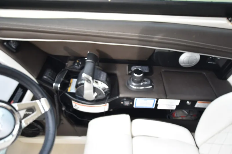 Slide: The Image of Control panel of a 2018 Sea Ray SLX 350 boat, featuring steering and throttle controls. - 14