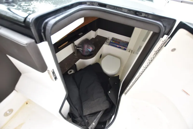 Slide: The Image of Interior view of 2018 Sea Ray SLX 350 boat bathroom with sink and toilet. - 17
