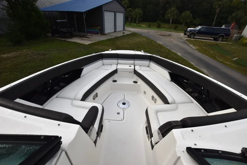 Slide: The Image of 2018 Sea Ray SLX 350 boat interior with white seating and black accents. - 7