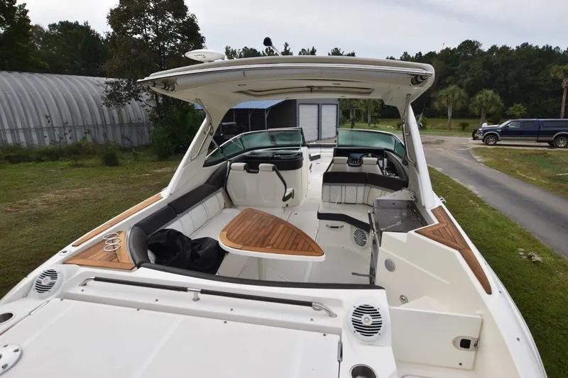 Slide: The Image of 2018 Sea Ray SLX 350 boat with spacious deck and luxurious seating. - 6
