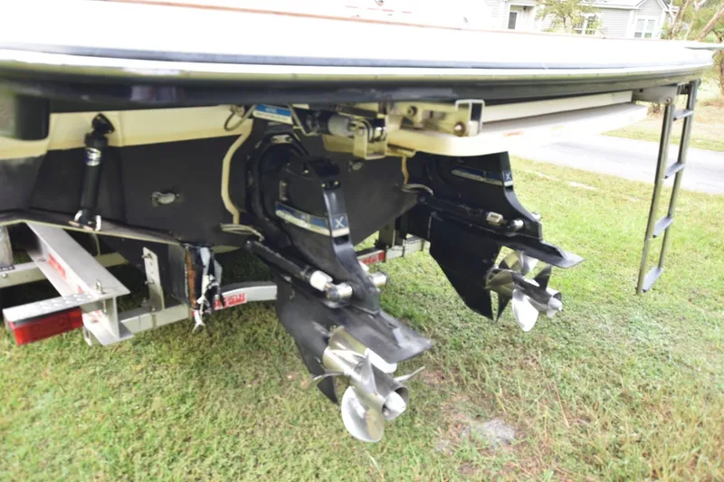 Slide: The Image of Rear view of 2018 Sea Ray SLX 350 boat with dual propellers on grass. - 5
