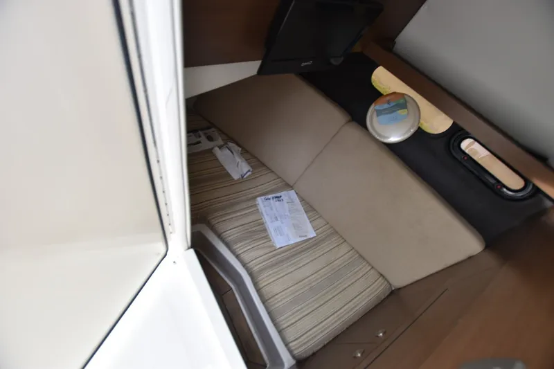 Slide: The Image of Interior cabin of 2018 Sea Ray SLX 350 boat with seating and storage. - 12