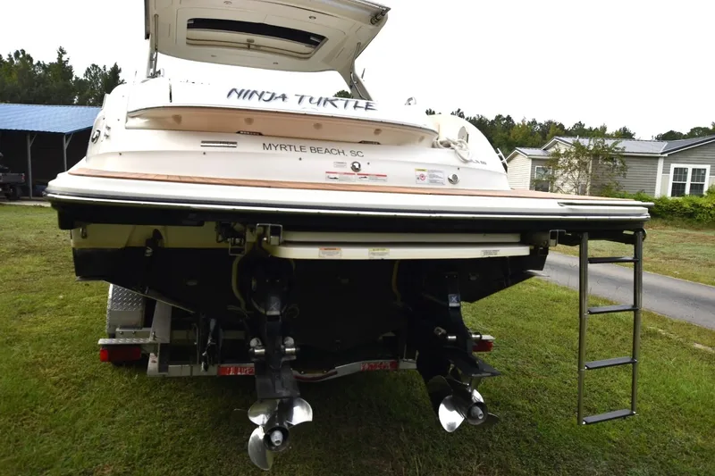 Slide: The Image of 2018 Sea Ray SLX 350 boat with dual propellers, parked on grass in Myrtle Beach. - 4