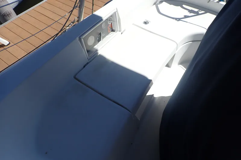 Slide: The Image of Cockpit seating area on a 2008 Hunter 33 sailboat, featuring control panel and deck view. - 35