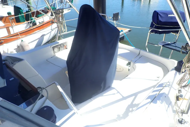 Slide: The Image of Cockpit of a 2008 Hunter 33 sailboat with covered helm, docked at marina. - 4