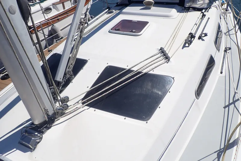 Slide: The Image of Deck of a 2008 Hunter 33 sailboat with rigging and hatches visible. - 10