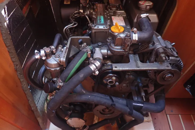 Slide: The Image of Engine compartment of a 2008 Hunter 33 sailboat, showcasing detailed mechanical components. - 44