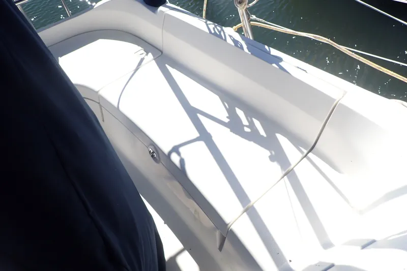Slide: The Image of Cockpit seating area on a 2008 Hunter 33 sailboat, with sunlight and shadows. - 36