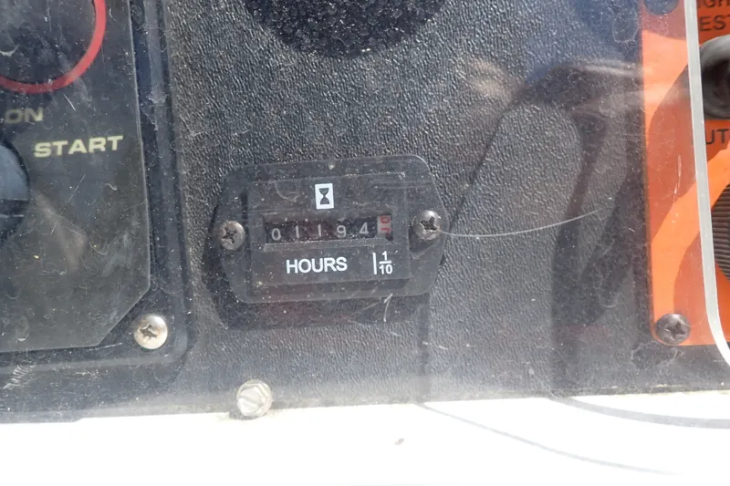 Slide: The Image of Hour meter reading 1194 on a 2008 Hunter 33 boat dashboard. - 47