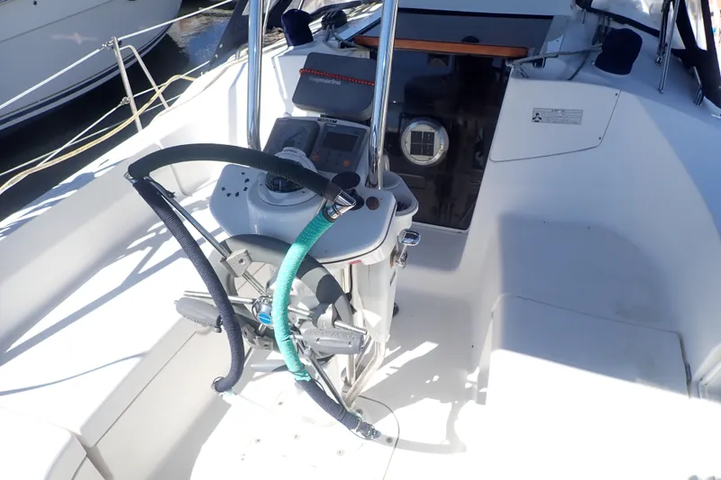 Slide: The Image of Cockpit of 2008 Hunter 33 sailboat with steering wheel and navigation instruments. - 39
