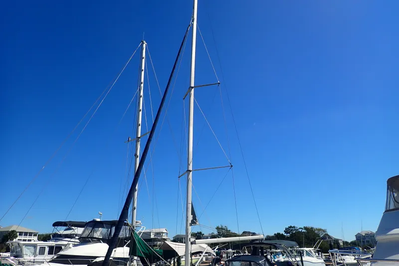 Slide: The Image of Sailboats docked under clear blue sky, featuring a 2008 Hunter 33 model. - 40