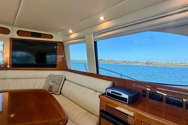 Slide: The Image of Luxurious interior of 2006 Riviera 40 Flybridge yacht with scenic water view. - 21