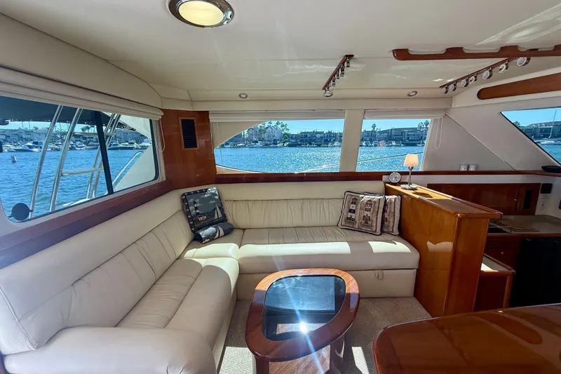 Slide: The Image of Luxurious interior of a 2006 Riviera 40 Flybridge yacht with waterfront view. - 13