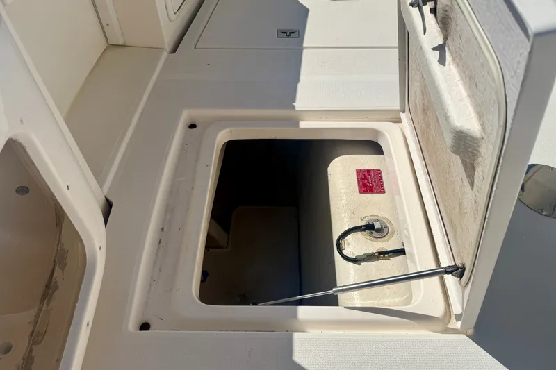 Slide: The Image of Open hatch on 2006 Riviera 40 Flybridge boat deck, revealing storage compartment. - 66