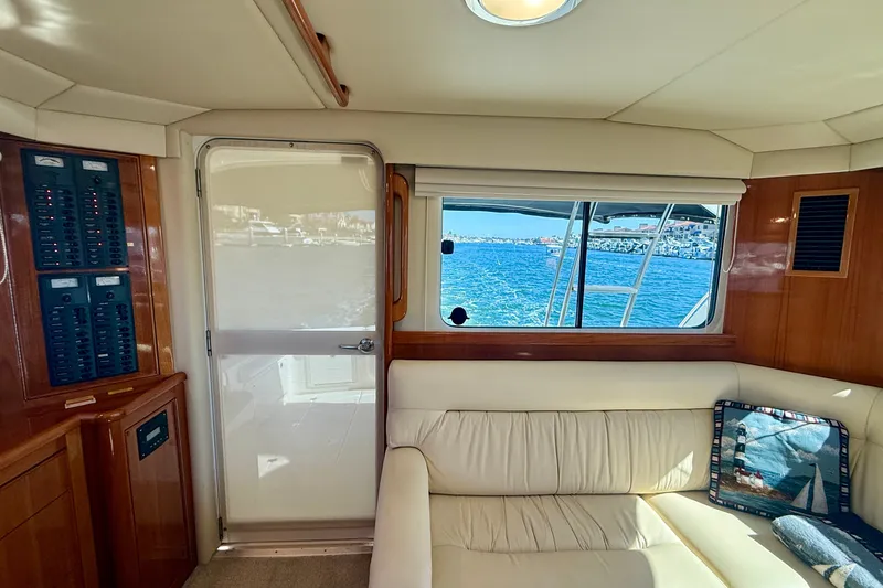 Slide: The Image of Interior of 2006 Riviera 40 Flybridge yacht with ocean view through window. - 17