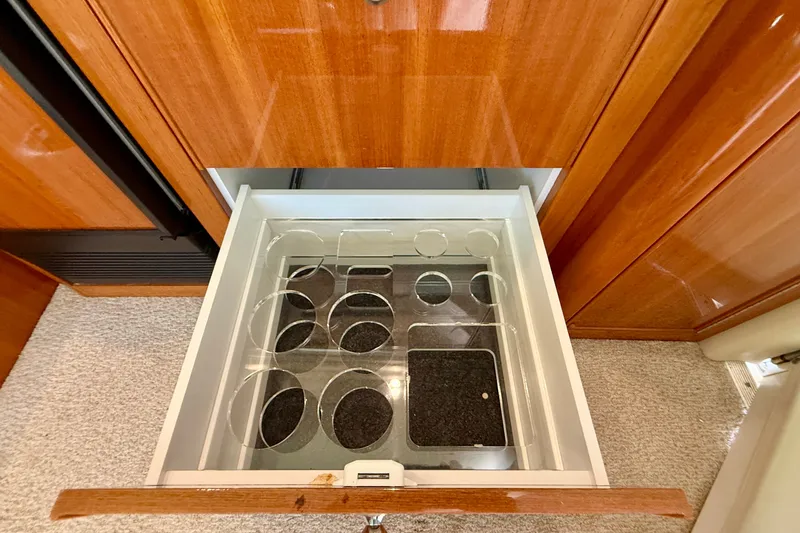 Slide: The Image of Open drawer with glass holder in 2006 Riviera 40 Flybridge yacht interior. - 33