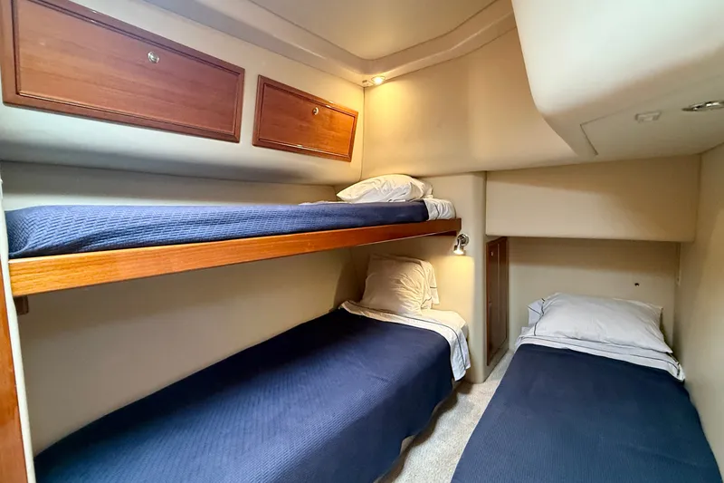 Slide: The Image of Cozy cabin with twin beds in 2006 Riviera 40 Flybridge yacht. - 52