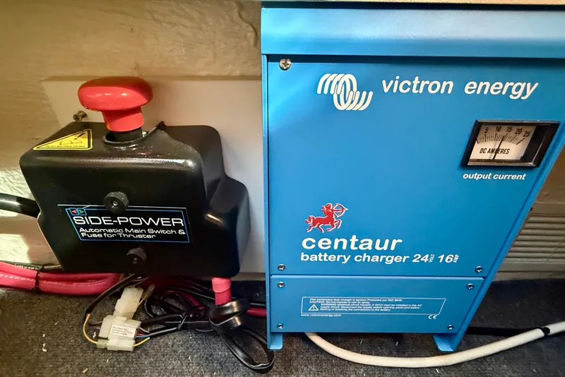 Slide: The Image of Victron Energy Centaur battery charger and Side-Power switch in 2006 Riviera 40 Flybridge. - 99