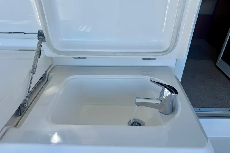 Slide: The Image of Sink with chrome faucet on 2006 Riviera 40 Flybridge yacht. - 62