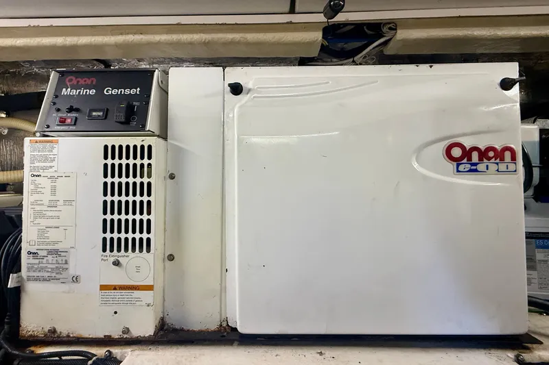 Slide: The Image of Onan marine generator in a 2006 Riviera 40 Flybridge yacht engine room. - 95