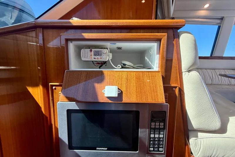 Slide: The Image of Interior of 2006 Riviera 40 Flybridge with microwave and communication equipment. - 39