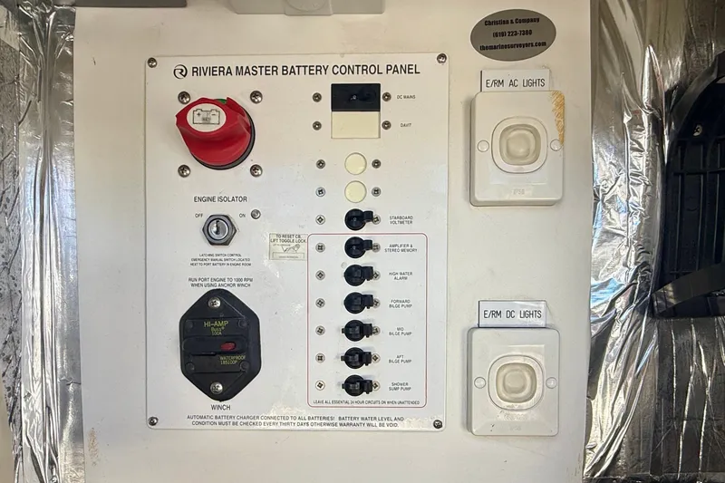 Slide: The Image of Riviera 40 Flybridge 2006 master battery control panel with switches and labels. - 93