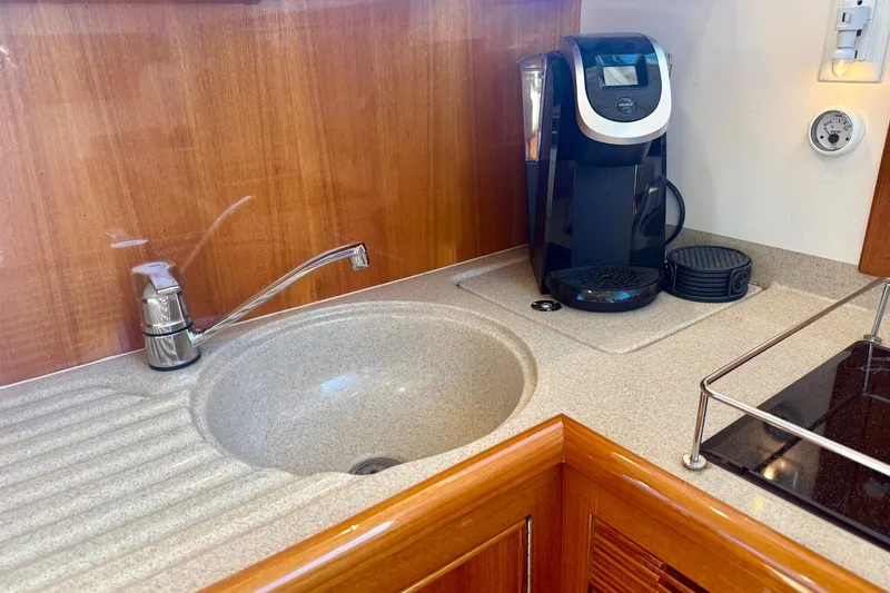 Slide: The Image of Kitchen area of 2006 Riviera 40 Flybridge with sink and coffee maker. - 26