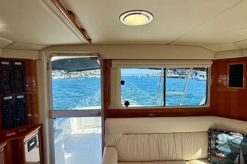 Slide: The Image of Interior view of 2006 Riviera 40 Flybridge yacht with ocean scenery through windows. - 18