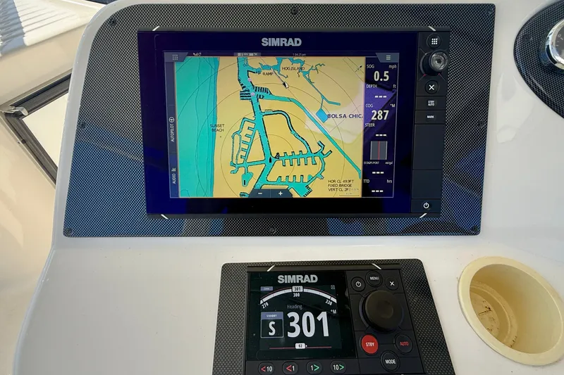Slide: The Image of Simrad navigation system on 2006 Riviera 40 Flybridge boat, displaying coastal map. - 79