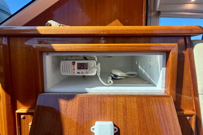 Slide: The Image of Wooden interior of 2006 Riviera 40 Flybridge with built-in radio compartment. - 40