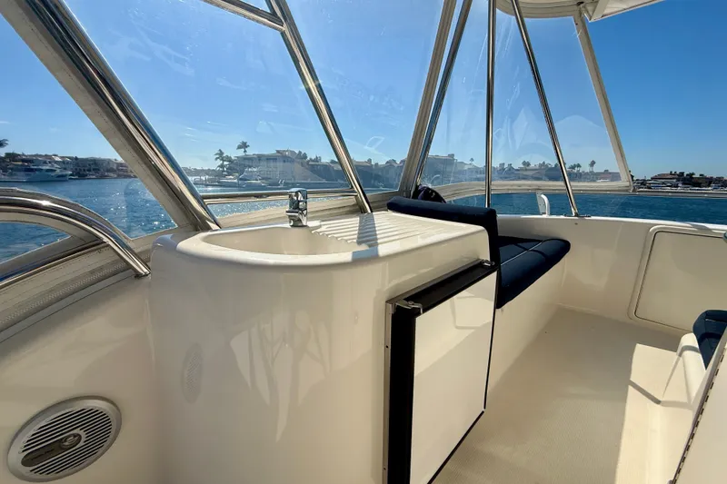 Slide: The Image of Interior view of 2006 Riviera 40 Flybridge yacht with sink and seating area. - 86
