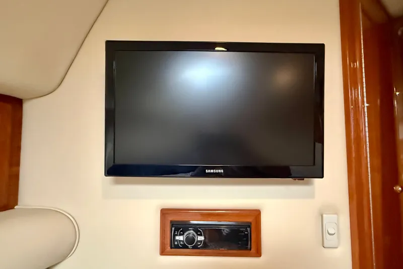 Slide: The Image of Samsung TV and control panel inside 2006 Riviera 40 Flybridge yacht cabin. - 45