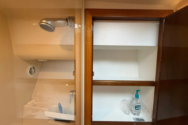 Slide: The Image of Bathroom cabinet and shower in 2006 Riviera 40 Flybridge yacht. - 51