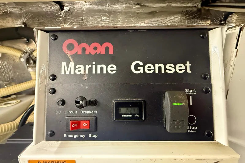 Slide: The Image of Onan Marine Genset control panel on 2006 Riviera 40 Flybridge yacht. - 96