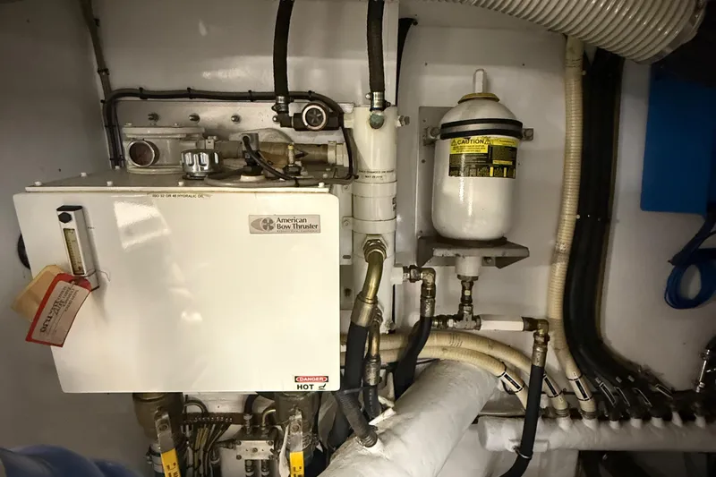 Slide: The Image of Engine room of a 2014 Hampton Fly, featuring American Bow Thruster system. - 42