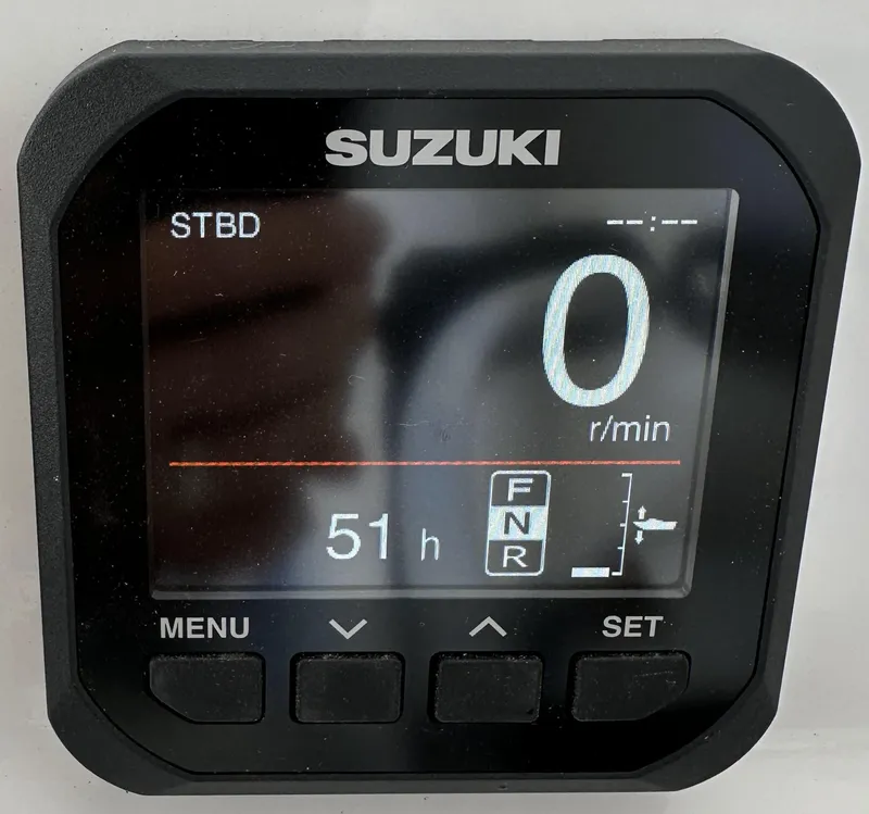 Slide: The Image of Suzuki digital display showing 0 RPM and 51 hours on a Custom Carolina boat. - 13