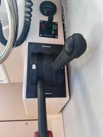 Slide: The Image of Close-up of throttle controls on a 1999 Atlas Boat Works Acadia 25. - 24