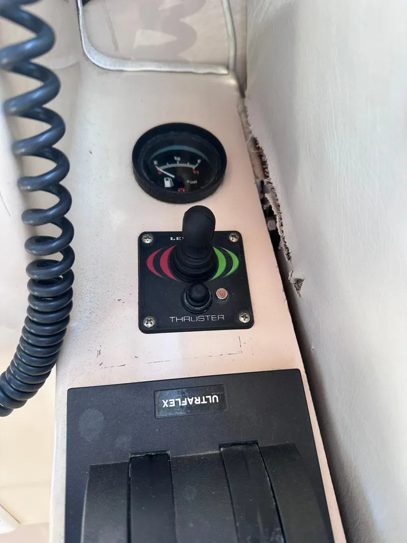 Slide: The Image of Control panel of 1999 Atlas Boat Works Acadia 25 with thruster joystick and gauge. - 20