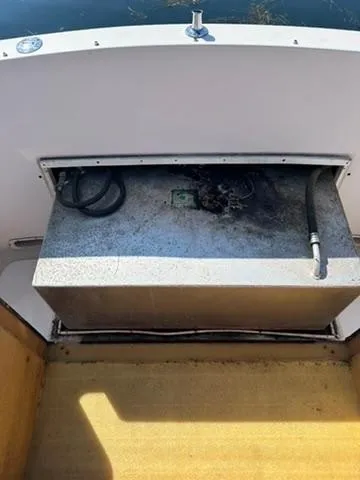 Slide: The Image of 1999 Atlas Boat Works Acadia 25 fuel tank with hoses, interior view. - 23