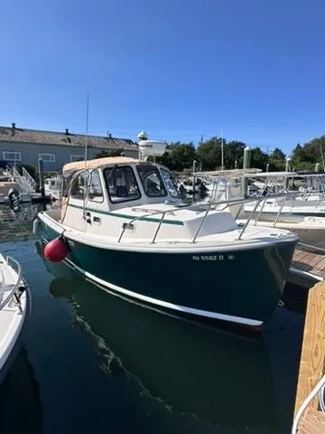 Slide: The Image of 1999 Atlas Boat Works Acadia 25 docked in marina, sunny day. - 4