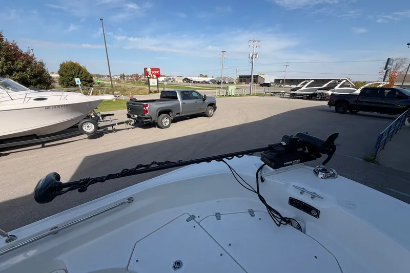Slide: The Image of 2022 Boston Whaler 170 Montauk with Minn Kota trolling motor in parking lot. - 5