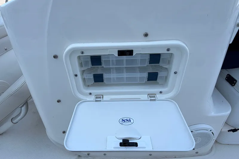 Slide: The Image of Storage compartment on a 2022 Boston Whaler 170 Montauk boat, featuring SSI logo. - 11