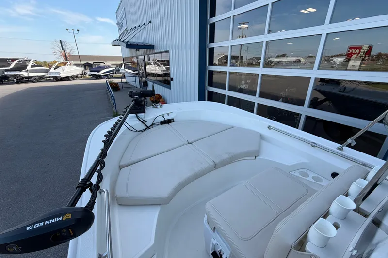 Slide: The Image of 2022 Boston Whaler 170 Montauk boat displayed outside dealership with other boats. - 8