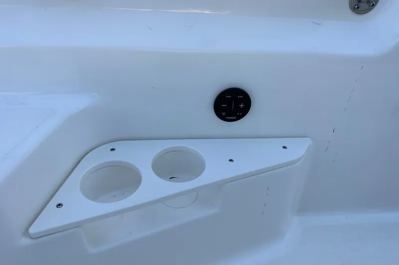 Slide: The Image of Cup holders and control panel on 2022 Boston Whaler 170 Montauk boat interior. - 15