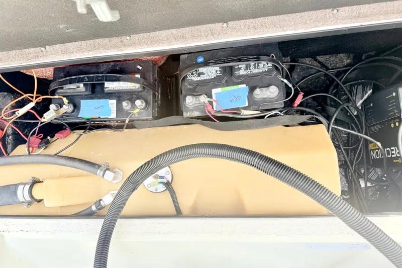 Slide: The Image of Interior view of a 1994 Skeeter SS140 boat showing battery compartment and wiring. - 33